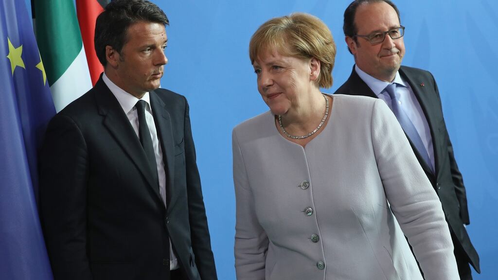 German Chancellor Angela Merkel, French President Francois Hollande (R) and Italian Prime Minister Matteo Renzi depart after speaking to the media during talks at the Chancellery Monday in Berlin, Germany.  Photograph:  Sean Gallup/Getty Images