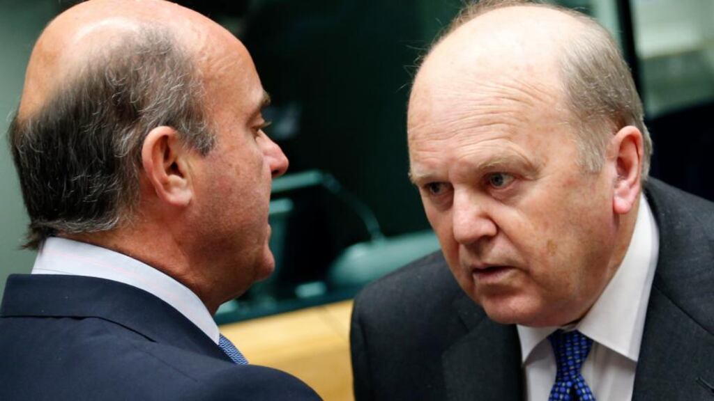 Spain’s Economy Minister Luis de Guindos talks to Minister for Finance Michael Noonan during an European Union finance ministers meeting in Brussels. Photograph: Francois Lenoir /Reuters