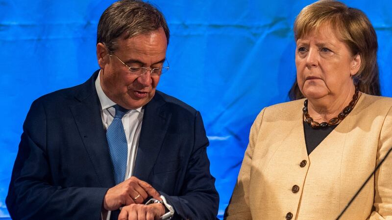 Armin Laschet (L), chairman and chancellor candidate of Germany’s conservative Christian Democratic Union (CDU) party, as Angela Merkel looks on during an election campaign meeting. Photograph: John MacDougall/AFP via Getty Images