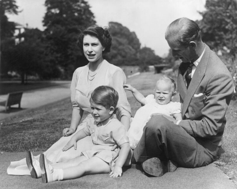 Princess Elizabeth and Prince Philip in 1951 with their two children, Prince Charles and Princess Anne in the grounds of Clarence House, London. Photograph: Fox Photos/Getty Images
