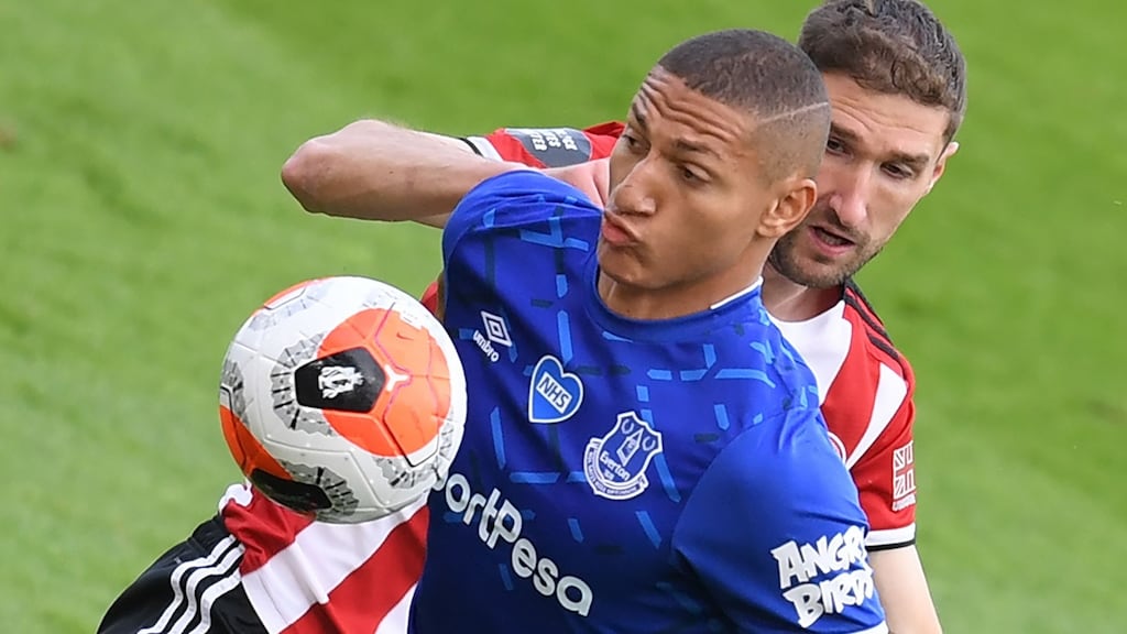 Everton striker Richarlison holds off the challenge of  Sheffield United defender Chris Basham during the Premier League  match at Bramall Lane. Photograph: Michael Regan/AFP via Getty Images