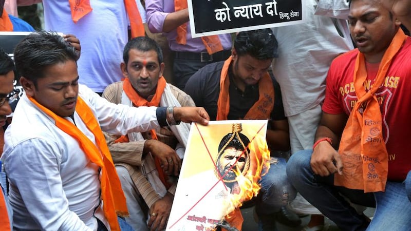 Activists from hardline organisation Hindu Sena burn posters and shout slogans in support of the death sentence for Yakub Memon. Photograph: Harish Tyagi/EPA