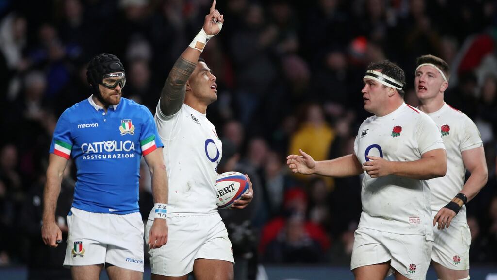 Manu Tuilagi celebrates scoring a try with Jamie George and Tom Curry. Photograph: Peter Cziborra/Reuters