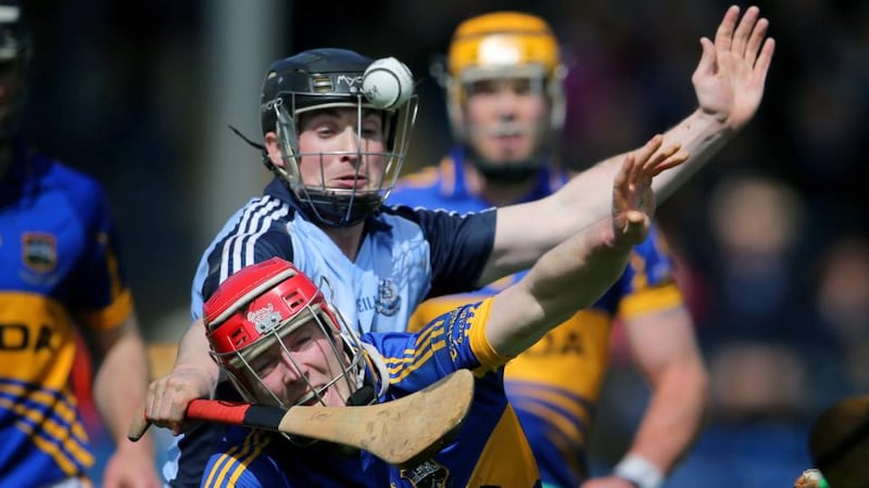 Tipperary's Michael Cahill is challenged by David O'Callaghan of Dublin. Photograph: Cathal Noonan/Inpho