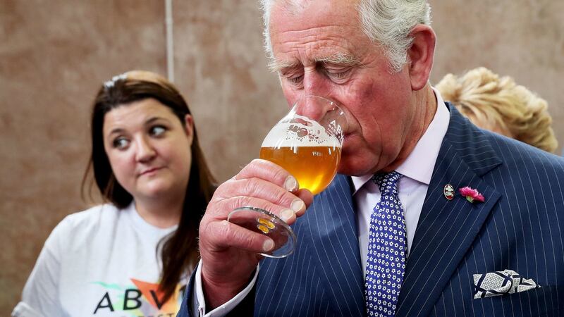The Prince of Wales samples a special brew created for the ABVFest beer festival at Carlisle Memorial Church in Belfast. Photograph: Brian Lawless/PA Wire.