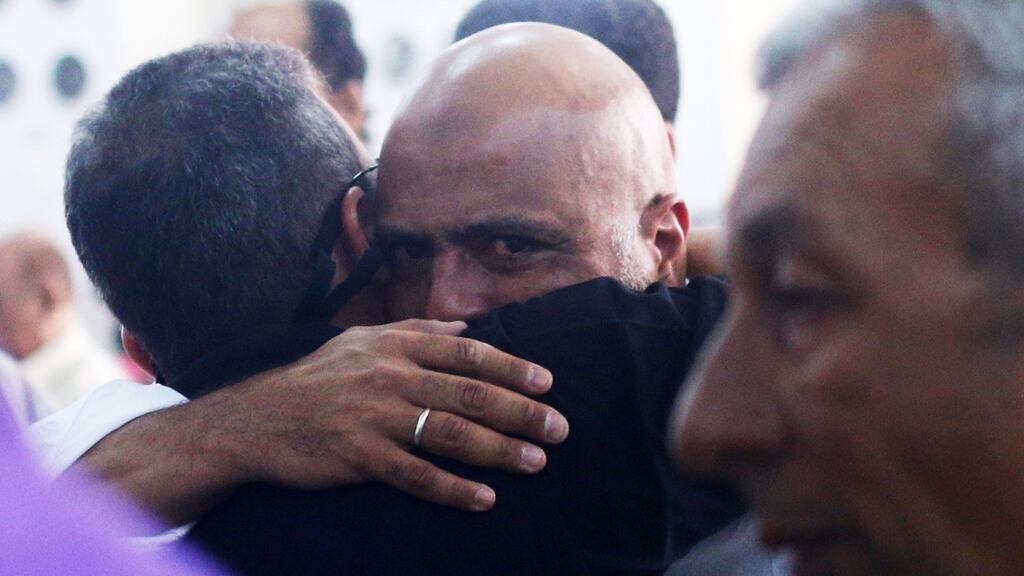 Relatives and friends of passengers of the EgyptAir plane that crashed in the Mediterranean comfort each other in Cairo. Photograph: Mohamed Meteab/AFP/Getty Images