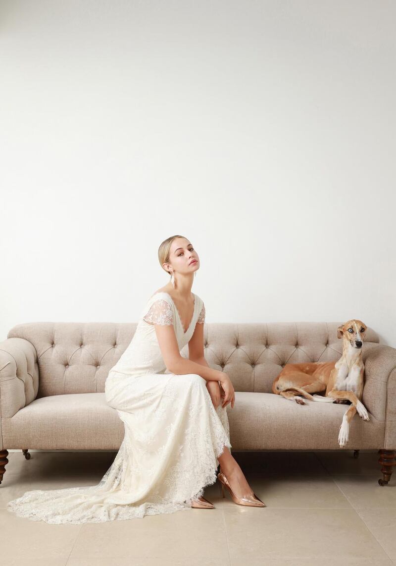 Ivory lace silk-lined gown with scalloped neckline and puddle train by Louise Kennedy