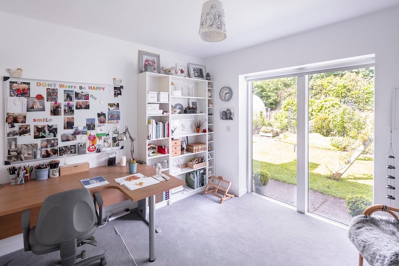 The fifth bedroom is laid out as a home office.