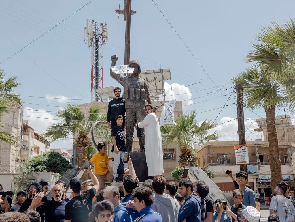 Pro-government protesters gather in Sahnaya, Syria, on Friday, after Israel had carried out air strikes on the country. It was the second time in days that Israel intervened militarily in Syria amid post-civil war sectarian violence there. Photograph: Nanna Heitmann/The New York Times