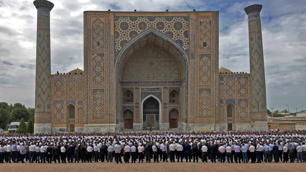 People attend the funeral ceremony of the late Uzbek president Islam Karimov at Samarkand’s Registan square. Photograph: HO/AFP/Getty Images