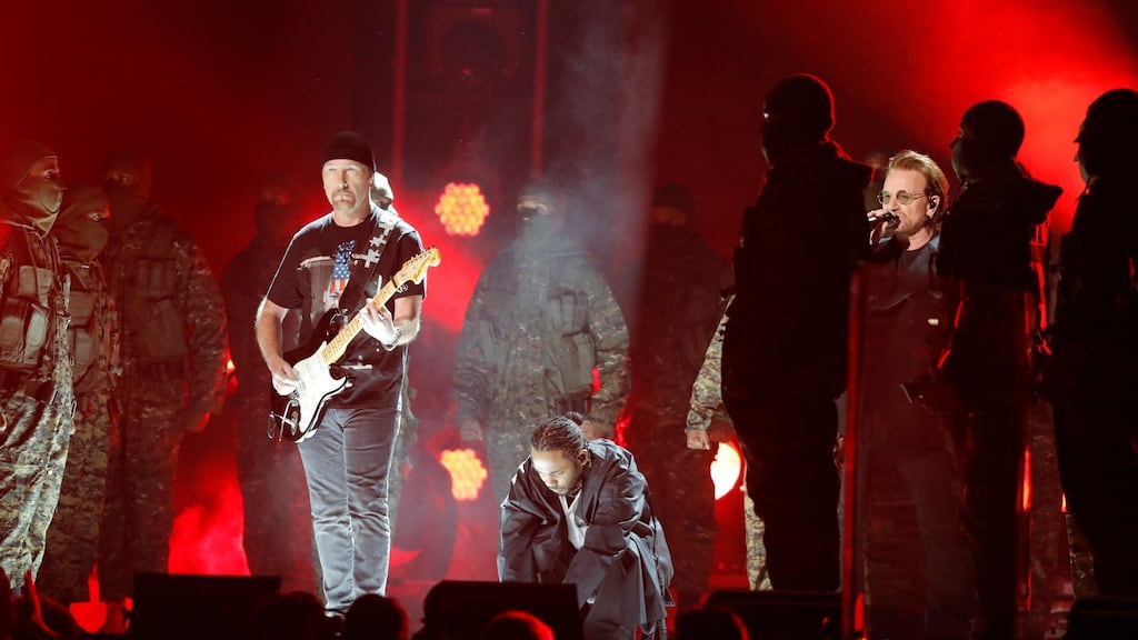Kendrick Lamar (C) performs with U2’s The Edge (L) and Bono. Photograph: Lucas Jackson/Reuters