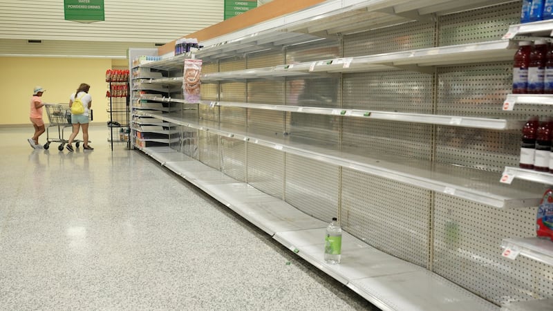A lone bottle of water sits on empty supermarket shelves as last-minute shoppers made final preparations ahead of the arrival of Hurricane Irma making landfall in Kissimmee, Florida on September 9, 2017. Photograph: Reuters/Gregg Newton