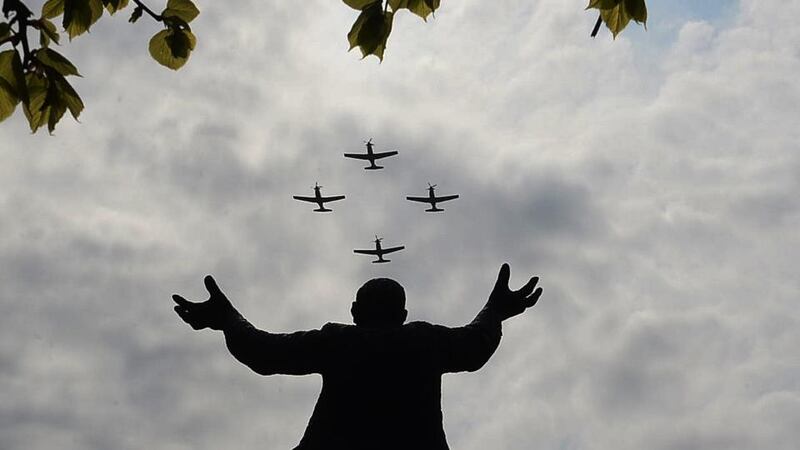 The Air Corps fly past over the Jim Larkin Statue at the GPO today. Photograph: Cyril Byrne/The Irish Times