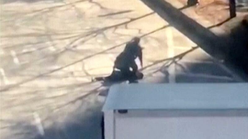 An image from a video shows the suspect in a deadly attack being apprehended by police. Photograph: YouTube/Tawhid Kabir