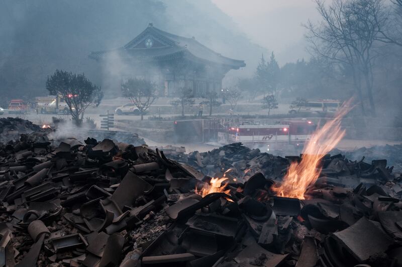 Embers remain among the debris after most of the buildings were burned to the ground in a wildfire at Gounsa Temple in Uiseong on March 26th. Photograph: Getty Images