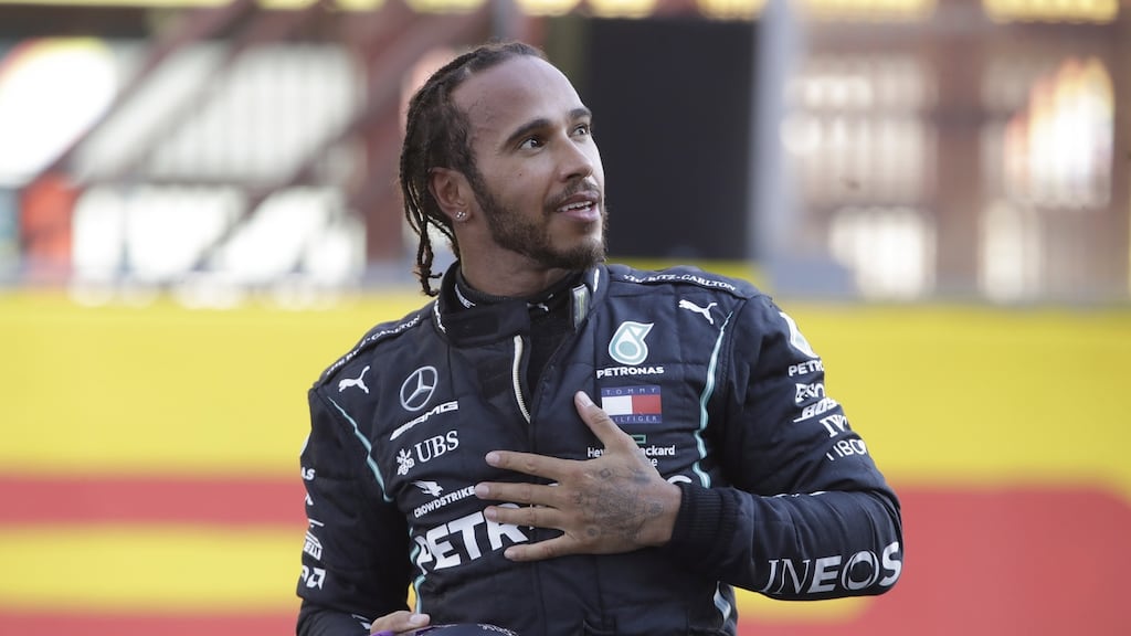 Lewis Hamilton celebrates after his victory in Tuscany. Photograph: Luca Bruno/EPA