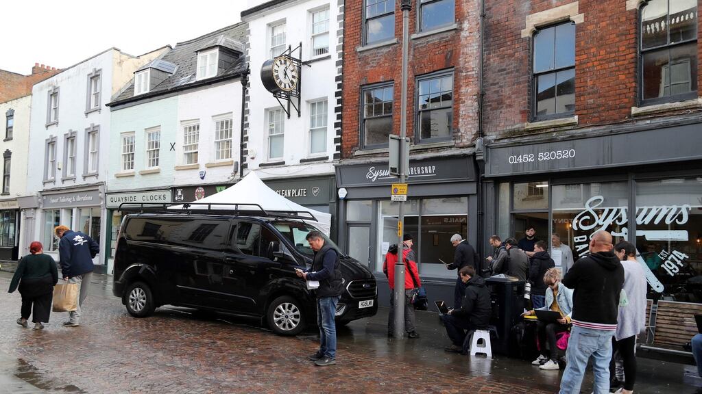 A police forensics tent is pictured outside The Clean Plate cafe in Gloucester, western England. Photograph: Geoff Caddick/AFP/  via Getty Images