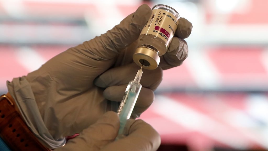 A health worker prepares a dose of the AstraZeneca coronavirus vaccine against Covid-19 in Madrid.
