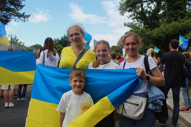 Ukrainian sisters Victoria Malaki and Oksana Derevianko with their children Kiril Malaki and Polina Derevianko at a protest outside the Russian embass. Photograph: Simon Carswell