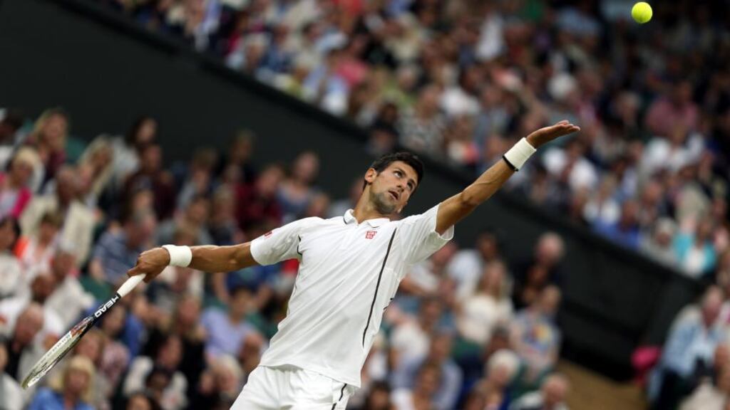 Serbia’s Novak Djokovic in action against USA’s Bobby Reynolds during day four of the Wimbledon Championships.
