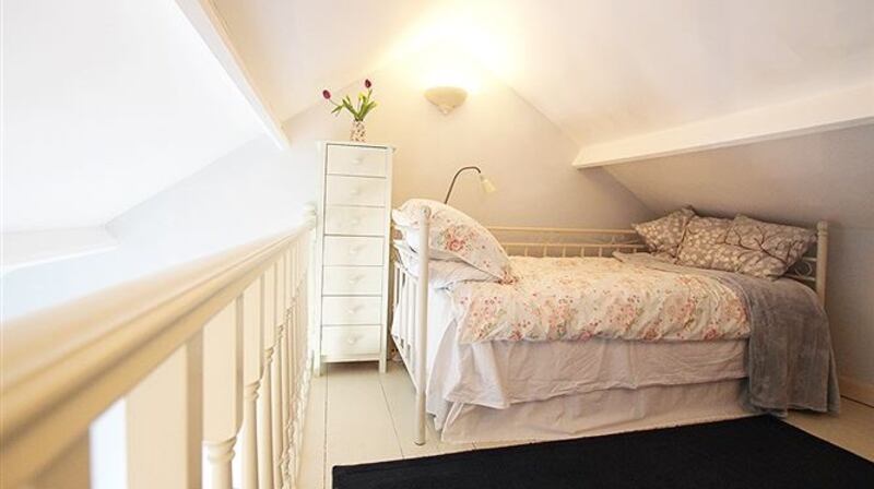 A mezzanine bedroom at 14 Station Road Cottages