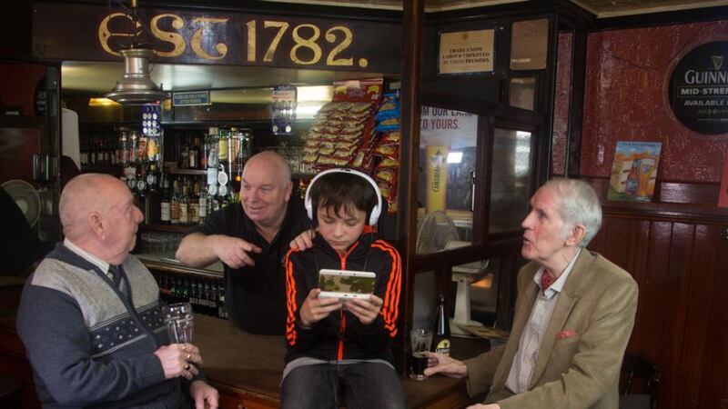 William “Spud” Murphy, barman Christy Hynes, Sam O’Connor and Richard Whyte in Mulligan’s bar. Photograph: Cathy Dunne/Jill Kenny