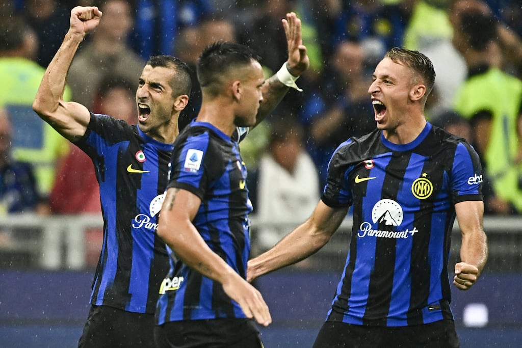 Inter Milan's Armenian midfielder Henrikh Mkhitaryan (L), Lautaro Martinez (C) and Davide Frattesi (R) celebrate during a match against AC Milan in September. US fund Oaktree Capital Management said it had now taken over the club. Photograph: GABRIEL BOUYS / AFP