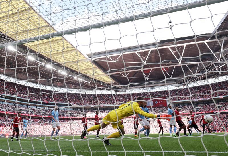 Manchester City's Ilkay Gündogan scores his team's second goal against Manchester United in the FA Cup final. Photograph: Adrian Dennis/AFP/Getty Images