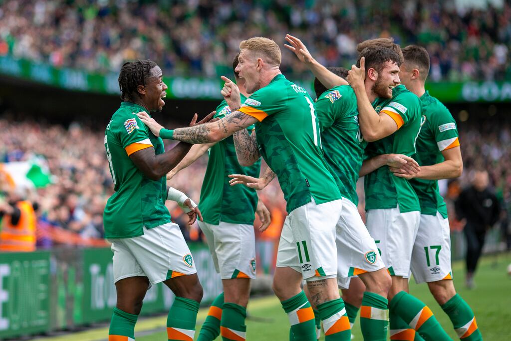 Ireland's Michael Obafemi is congratulated by James McClean after assisting in the second goal for Troy Parrott who is congratulated by team mates during the Republic of Ireland v Scotland match at Aviva Stadium. Photograph: Tim Clayton/Corbis via Getty Images
