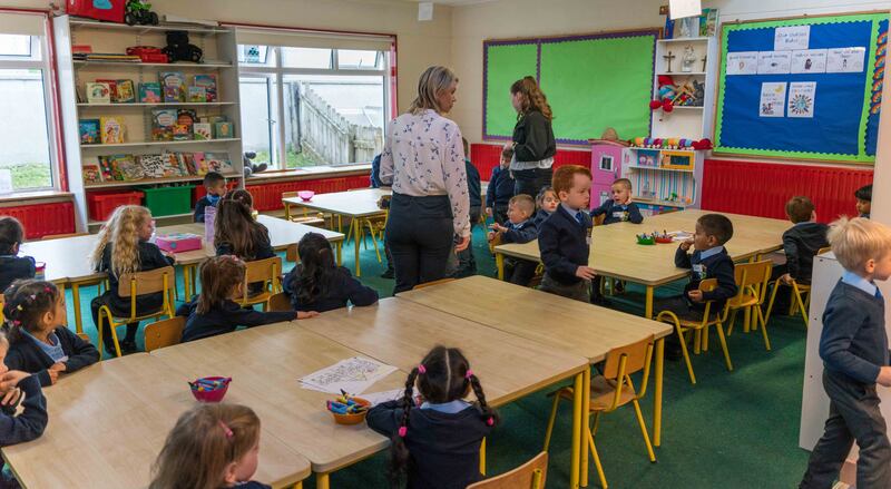 Ailbhe Nangle and Elaine Keappock with some of their 32 junior infants. Photograph: Gerry Faughnan