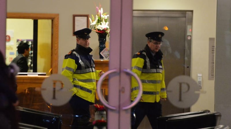 Gardai are seen at the Plaza Hotel in Tallaght yesterday where the body of a woman was found in a room at the hotelPhotograph: Alan Betson/The Irish Times