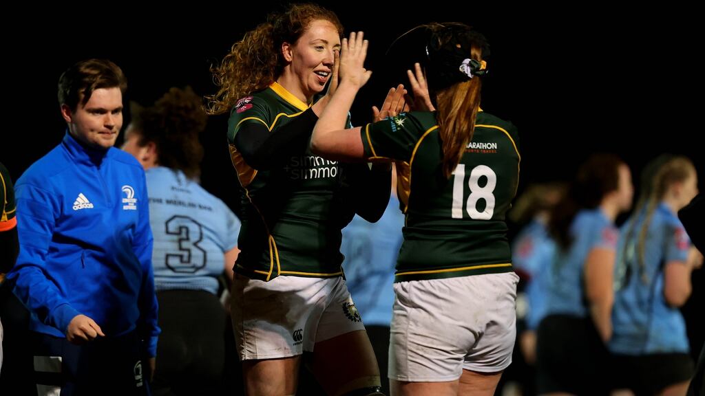 Railway Union’s Aoife McDermott and Sonia McDermott celebrate after the game against Galwegians. Photograph:  Ryan Byrne/Inpho