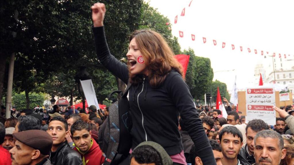 Tunisian protesters shout slogans during a demonstration on Tuesday to mark the third anniversary of the uprising that ousted president Zine El Abidine Ben Ali, at the Avenue Habib Bourguiba in Tunis. The country is close to agreeing a new constitution. Photograph: EPA