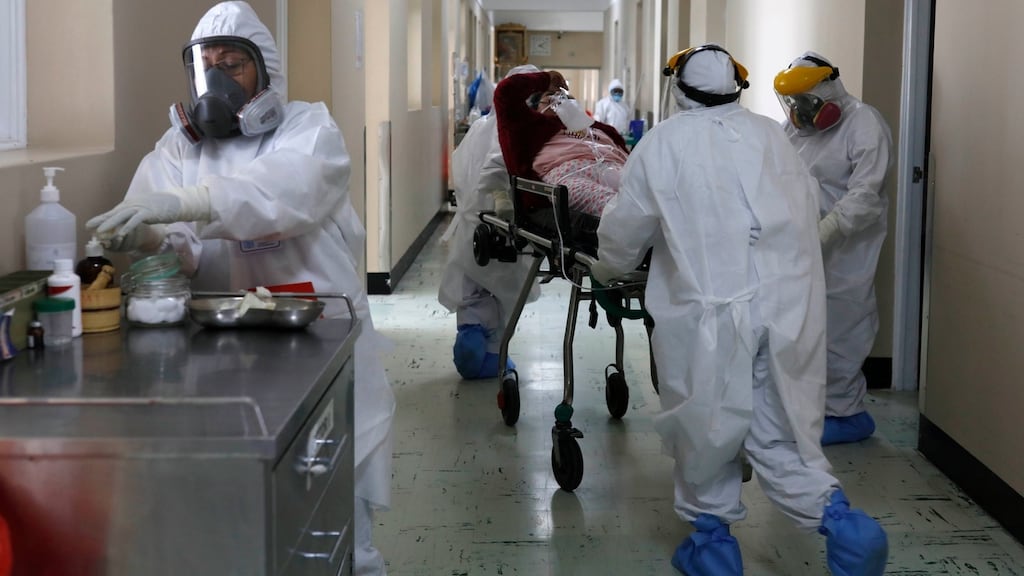 Medical staff transport a Covid-19 patient at the Honorio Delgado Hospital in Arequipa, Peru.  Photograph: Guadalupe Pardo/AP/File