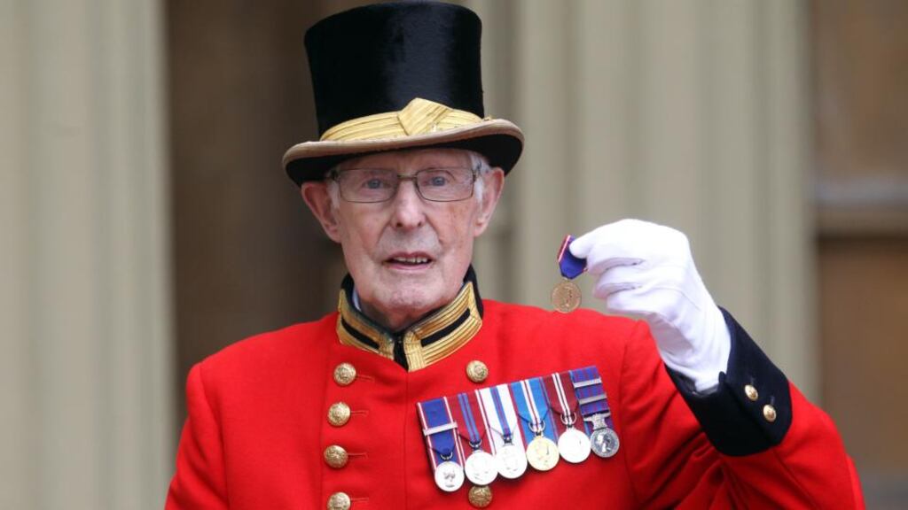 Pat Carroll poses with the medal he received from the queen today for his 60 years of service at Buckingham Palace. Photograph: Getty