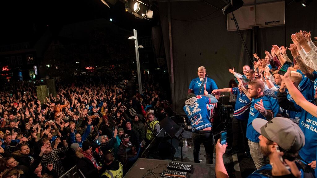 Iceland’s national team football players and coaching staff celebrate with fans at Ingolfstorg square in the centre of Reykjavik. Photograph: Halldor Kolbein/AFP /Getty Images
