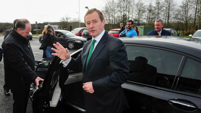 Taoiseach Enda Kenny waves to member of the media after  voting in Castlebar, Co Mayo.   Photograph: Aidan Crawley/Bloomberg