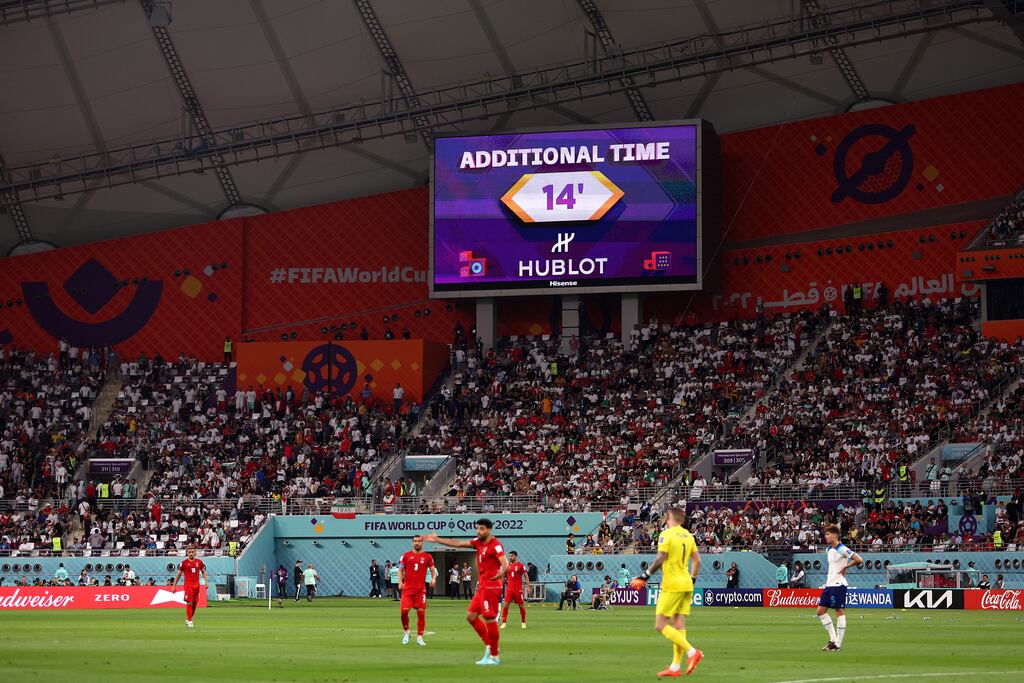 A giant screen displays additional time of 14 minutes during the England v Iran game at the Khalifa International Stadium in Doha, Qatar. Photograph: Richard Heathcote/Getty Images