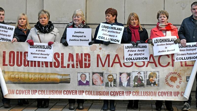 Families of victims protest outside Belfast High Court on Friday at a judicial review hearing on the Police Ombudsman’s report into the Loughinisland massacre in 1974. Photograph: Alan Lewis/Photopress Belfast