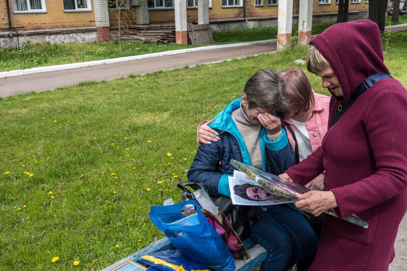Yuliia Kohut is hugged by Anzhelika Yatsyna as they learn that their sons are not on the list of prisoners of war to be released. Photograph: Brendan Hoffman/New York Times