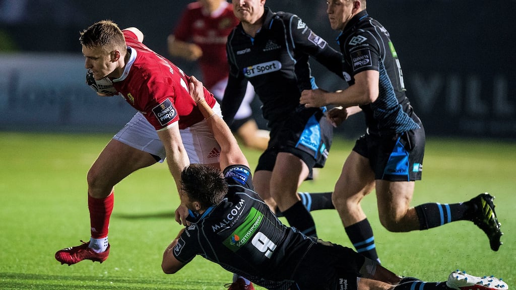 Munster’s Rory Scannell tackled by Ali Price of the Glasgow Warriors during their Pro12 clash. Photo: Craig Watson/Inpho