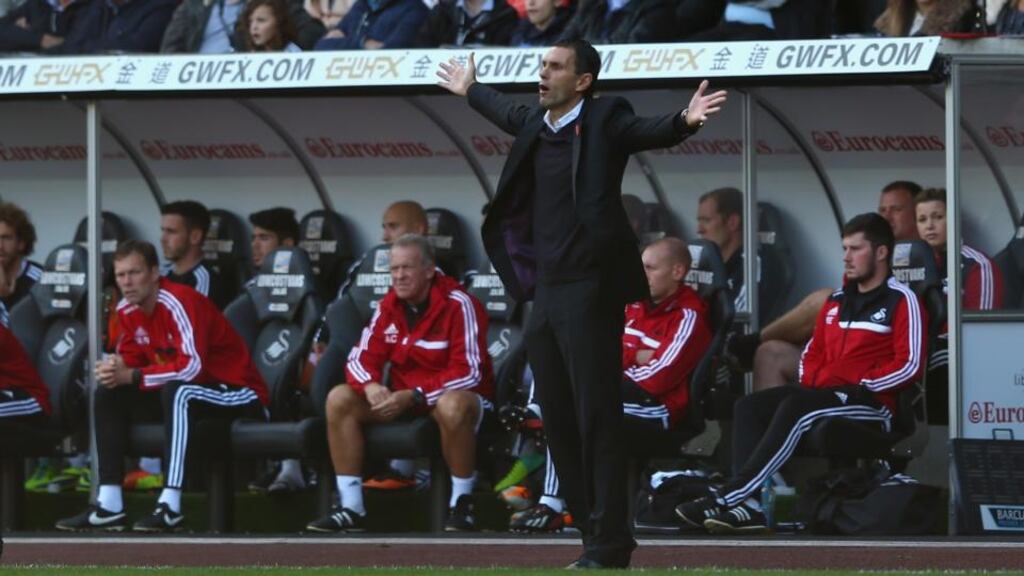 Sunderland’s Gus Poyet during his first Premier League game as the club’s manager when his side were beaten 4-0 by Swansea City at the Liberty Stadium last weekend.