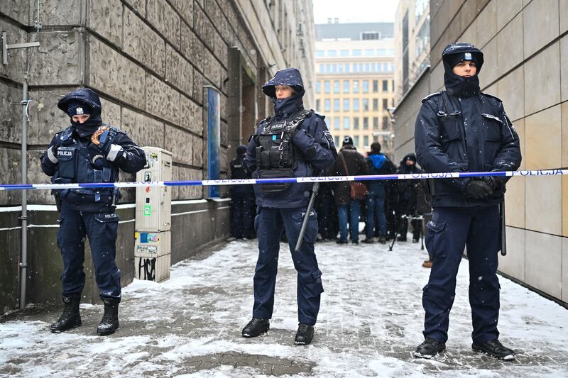 Police officers block the entrances to the Television Information Agency after Poland's new minister for cultures dismissed the heads of the state television channel and Polish Radio. Photograph: Omar Marques/Getty Images