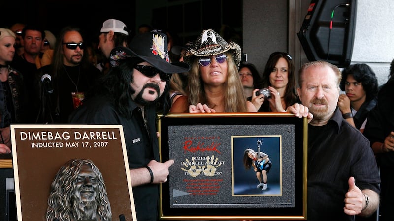 Pantera founder and drummer Vinnie Paul with Rita Hane and Jerry Abbott unveil a plaque in honour of former Pantera guitarist, the late Darrell ‘Dimebag’ Abbott during the induction to the Hollywood Rock Walk at Guitar Center, Hollywood, California, in 2007. File photograph: Vince Bucci/Getty Images for VH1