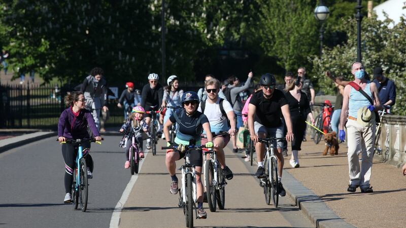 Cyclists crossing the Serpentine Bridge in Hyde Park, London, on Saturday, April 25th, 2020. Photograph: Jonathan Brady/PA Wire