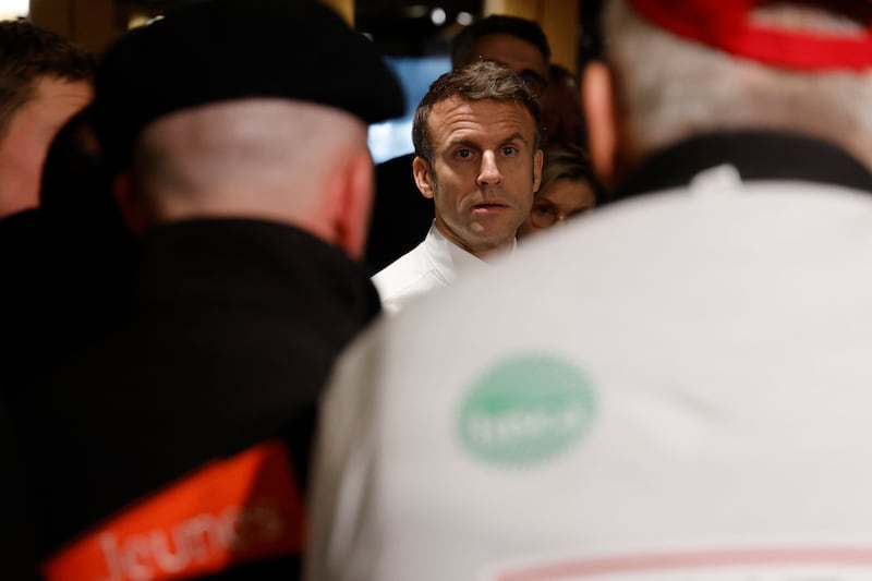 French president Emmanuel Macron takes part in a discussion with French farmers at the Porte de Versailles exhibition centre before the opening of the 60th International Agriculture Fair. Photograph: Ludovic Marin/AFP