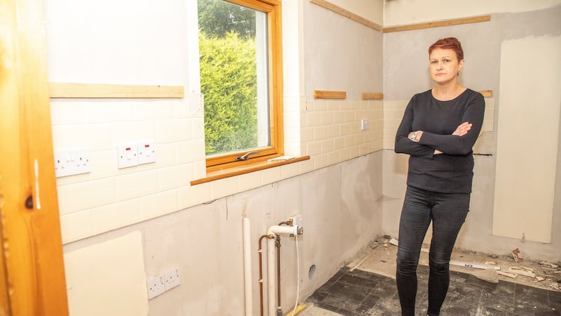 Caroline Long in the cleared-out utility room in her home, which is to be demolished due to mica. Photograph: NW Newspix