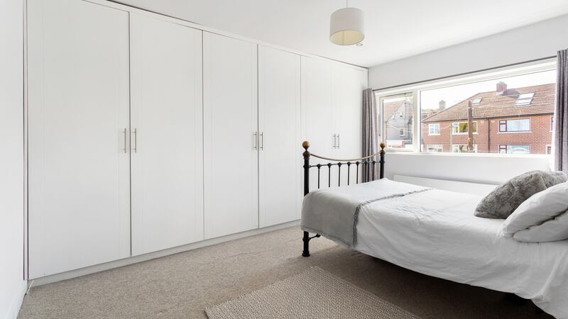 Front bedroom with wall of built-in wardrobes