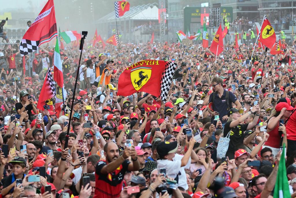 Supporters and Ferrari's fans celebrate Ferrari's Monegasque driver Charles Leclerc's victory. Photograph: Andrej Isakovic/AFP via Getty