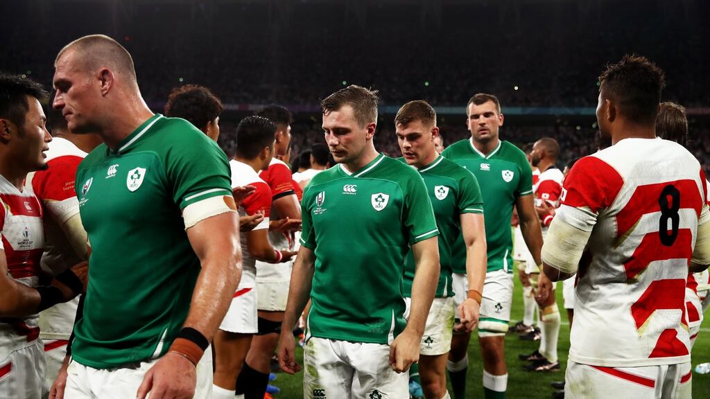 Ireland players leave the pitch following their defeat to Japan. Photograph: Cameron Spencer/Getty